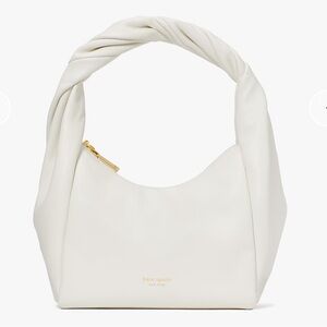 Kate Spade New York Twirl top-handle bag in nappa leather and white.